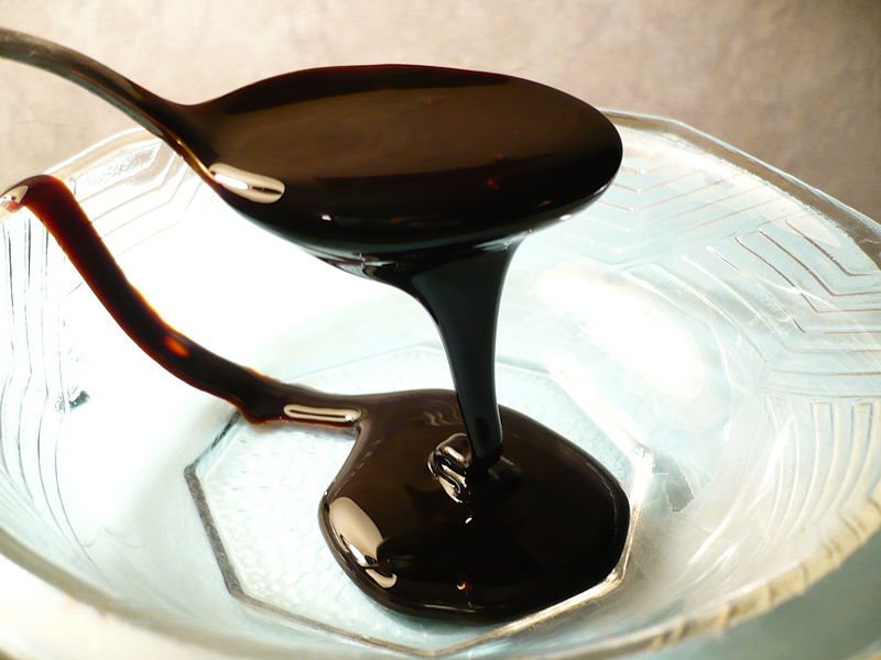 molasses poured from a spoon