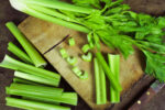 Raw celery on cutting board