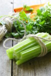 Raw celery stalks and leaves