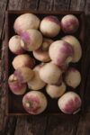 Purple top turnips on a wooden background