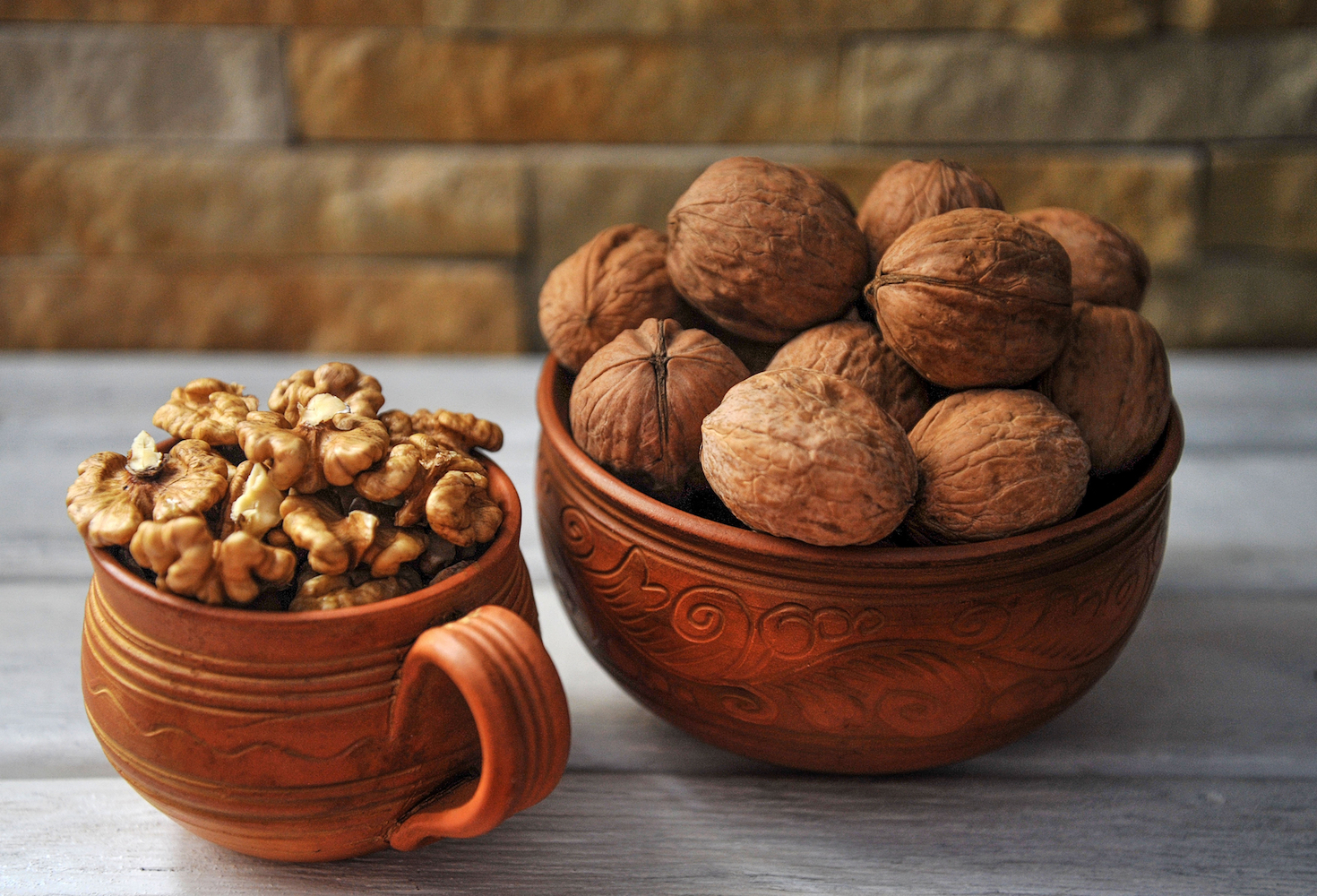 English walnuts in bowl and cup.