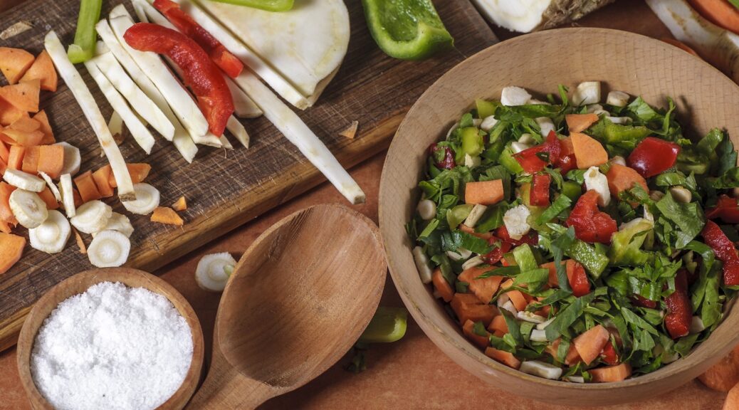 chopped vegetable in wooden bowl